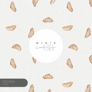 Op de afbeelding: Herhalend patroon van aquarel croissants in bruine tinten op een getextureerde, gebroken witte achtergrond. Het ontwerp bevat een cirkelvormig logo met de tekst "MINIS from Lumiel & Ginger DESIGN STUDIO". De woorden "CROISSANT" en "ECRU" staan in een donkergrijze box.