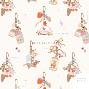 May include: A repeating pattern of whimsical keychains with various charms, including ice cream cones, strawberries, a pink taxi, and a dachshund. The keychains are connected by chains and adorned with bows and the text "LUMELO AND GINGER". The chain length is 220 mm.