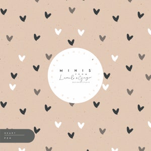 May include: A beige background with a repeating pattern of small black, white, and grey hearts. A white circle with the text "MINIS FROM Lumelo & Ginger DESIGN STUDIO" is in the centre of the image.