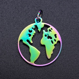 May include: A rainbow iridescent charm in the shape of a world map. The charm is made of metal and has a loop at the top for attaching to a necklace or bracelet.