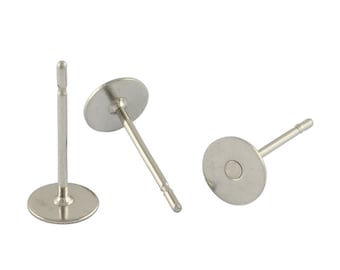 May include: Three silver earring posts with round flat backs. The posts are about 1 inch long.