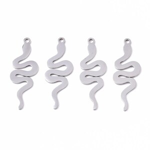 May include: Four silver snake charm pendants, each featuring a detailed, coiled snake design. These charms are ideal for adding a touch of whimsy and style to jewellery projects.