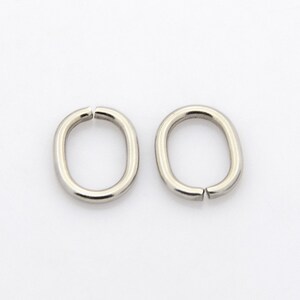 Anéis de salto ovais abertos de aço inoxidável de 25 x 13 mm x 11 mm x 2 mm com diâmetro interno de 9 mm x 7 mm