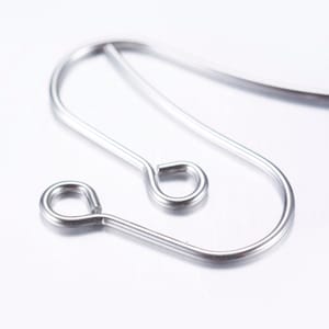 May include: Silver earring findings with a teardrop-shaped loop and a smaller circular loop.