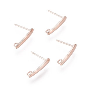 May include: Four rose gold earring findings with a loop at the end and a straight post. The findings are designed to be used with a variety of earring styles.