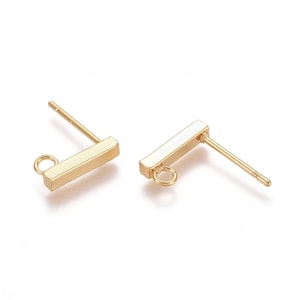 May include: Gold-toned earring findings with a rectangular bar and a small jump ring. The findings are designed to be used with other jewelry components.