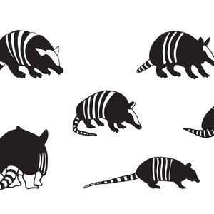 May include: A collection of six black and white armadillo illustrations. Each armadillo is depicted in a different pose, with striped shells and long tails. The illustrations are simple and graphic, suitable for various design applications.