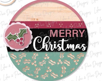 May include: A round, wooden sign with a layered design featuring a red and black background with the text "Merry Christmas" in white. The sign is decorated with a green holly sprig with red berries and a teal background with a repeating holly pattern.