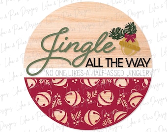 May include: A round wooden sign with a red and white pattern of bells and holly. The top half of the sign is wood with the text "Jingle All The Way" and "No One Likes A Half-Assed Jingler".