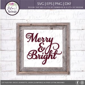 May include: A framed sign with a white background and a burgundy wood frame. The sign says "Merry & Bright" in a decorative script font.