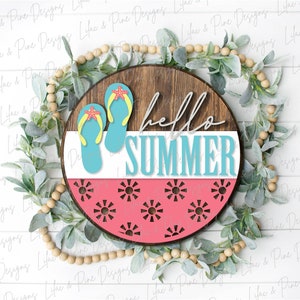 May include: A round wooden sign with the text "hello summer" in white script. The sign is decorated with two blue flip flops with orange starfish and a pink and white watermelon pattern.