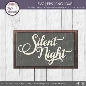 May include: A brown wooden frame with a gray background and white text that reads "Silent Night".