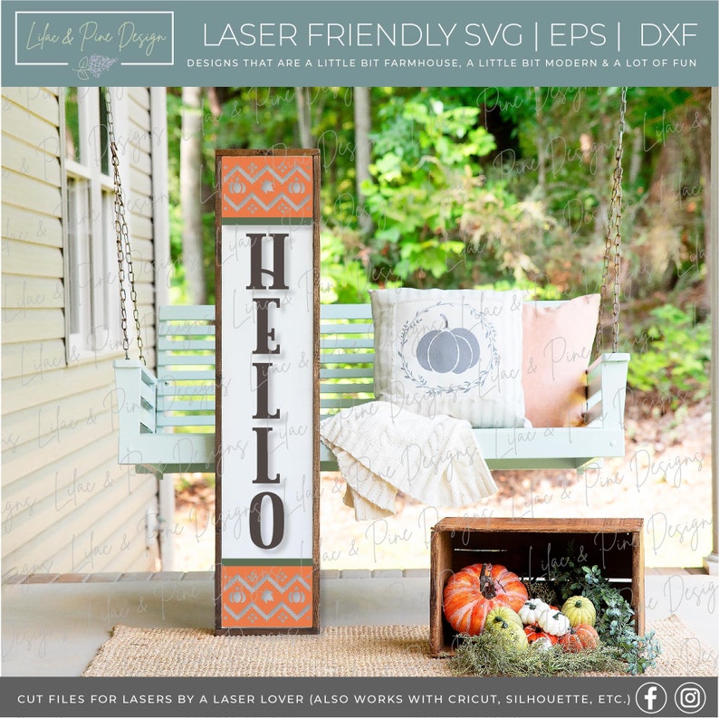 May include: A wooden sign with the word "HELLO" in brown letters on a white background. The sign has a peach and orange geometric pattern at the top and bottom. The sign is leaning against a light blue porch swing with a white throw blanket and a pillow with a gray pumpkin design. There are pumpkins in a wooden crate in the foreground.
