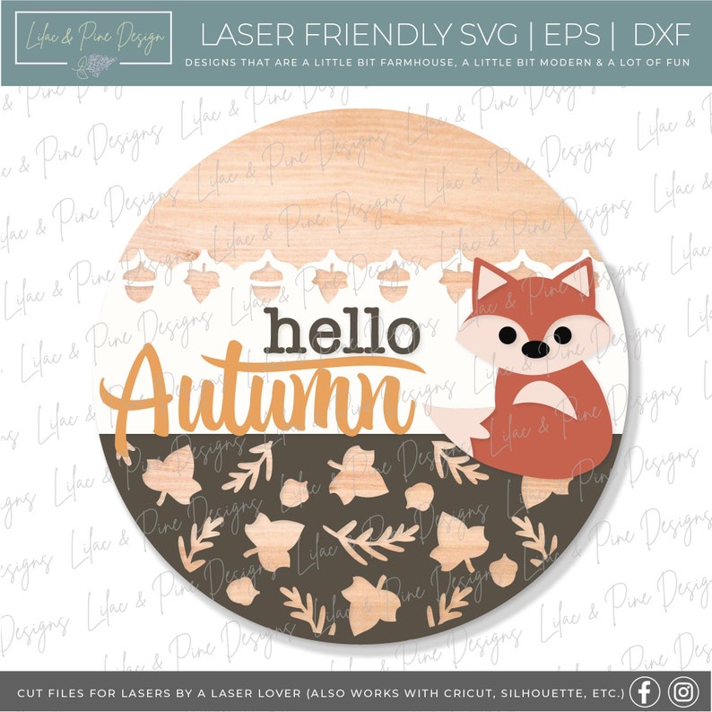 May include: A round wooden sign with a brown and white woodgrain pattern. The top half of the sign features a white lace design with acorns. The bottom half of the sign features a brown background with a pattern of leaves and acorns. The text "hello autumn" is written in orange and brown lettering. A red fox is sitting on the right side of the sign.