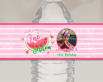 May include: Water bottle label with pink and white stripes, a watermelon graphic, and the text "Our Sweet Girl One Melon Amanda's 1st Birthday".