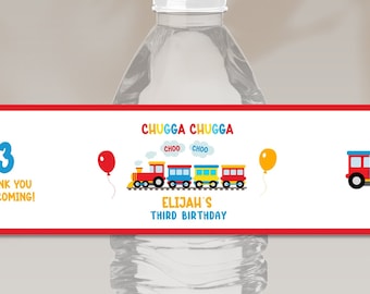 May include: Water bottle label with a red, yellow, and blue train design. The label says "Chugga Chugga" and "Elijah's Third Birthday".