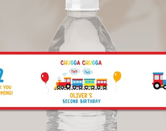 May include: Water bottle label with a red, yellow, and blue train design. The label says "Chugga Chugga" and "Oliver's Second Birthday".