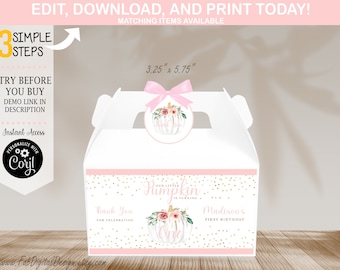 May include: A pink and white favor box with gold glitter accents. The box features a pumpkin design with the text "Our Little Pumpkin is Turning One" and "Madison's First Birthday".