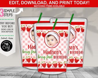 May include: Three juice boxes with a strawberry theme. Each box features a baby's photo, the text "Madison's berry first BIRTHDAY", and strawberry illustrations. The boxes have green straws and a red and white checked pattern.