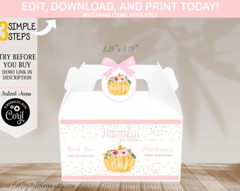 May include: A white gable box featuring a pink bow and a circular tag with a floral pumpkin illustration. The box displays the text Our Little Pumpkin Is Turning One, Thank You For Celebrating, and Madison's First Birthday, measuring 3.25 inches by 5.75 inches.