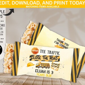 May include: Construction-themed party favor wrappers with text that reads "STOP THE TRAFFIC CLOSE THE ROAD" and "ELIJAH IS 3 YEARS OLD!" The wrappers have a yellow and black striped design, a construction truck graphic, and a "THANK YOU FOR COMING" message.