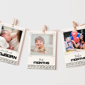 May include: Three baby milestone photo prints hanging from a string with clothespins. The prints feature photos of a baby at newborn, four months, and twelve months. Each print has text and a decorative border.