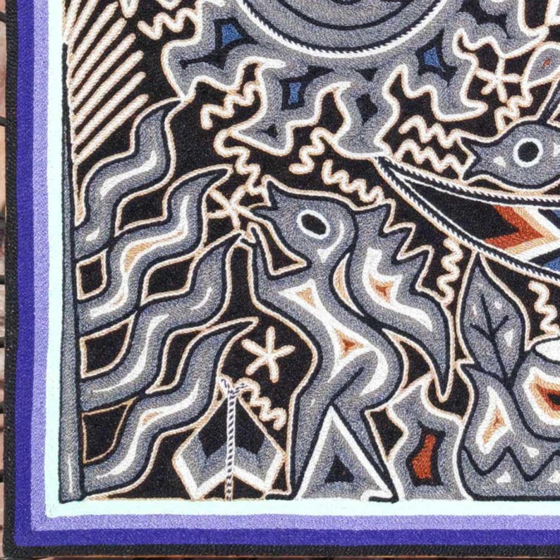 May include: A rectangular textile wall hanging featuring a black background with intricate, raised embroidery in shades of gray, white, blue, and brown. The design includes stylized figures, wavy lines, and geometric patterns with a purple border.