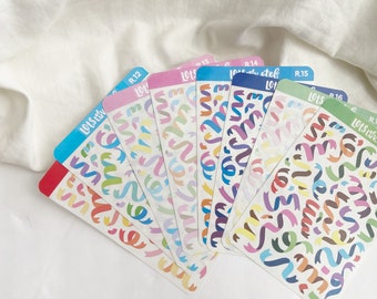 Puede incluir: Un conjunto de seis hojas de pegatinas coloridas con un patrón repetitivo de cintas de confeti. Cada hoja tiene un esquema de color diferente, incluyendo rosa, azul, amarillo, verde y morado. Las hojas están etiquetadas con el texto "Lots Liv" y un número.