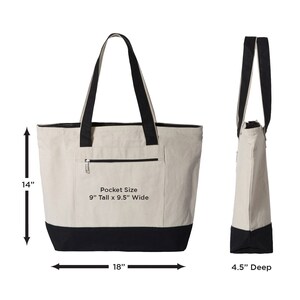 May include: A large beige canvas tote bag with black handles and a black bottom. The bag has a zippered pocket on the front with the text "Pocket Size 9" Tall x 9.5" Wide". The bag measures 14" tall, 18" wide, and 4.5" deep.