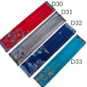 May include: Four rectangular fabric panels labeled D30, D31, D32, and D33. The first is red, the second gray, the third dark blue, and the fourth teal. Each features a floral pattern at one end with blue, pink, and green botanical details.