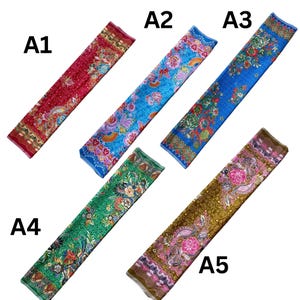May include: Five rectangular fabric strips labeled A1 through A5, each featuring distinct floral and paisley patterns in red, light blue, dark blue, green, and brown. Each strip displays intricate, colorful botanical motifs and decorative borders.