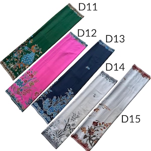 May include: Five rectangular fabric panels labeled D11 through D15. D11 is dark green with a peacock print. D12 is bright pink with floral patterns. D13 is navy blue with blue floral motifs. D14 and D15 are white with black and red floral designs.