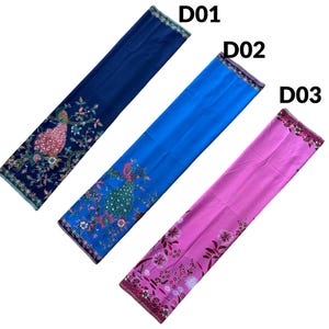May include: Three rectangular fabric panels labeled D01, D02, and D03. D01 is dark blue with a peacock and floral print. D02 is bright blue with a peacock and floral print. D03 is pink with a floral and dandelion-like botanical print pattern.