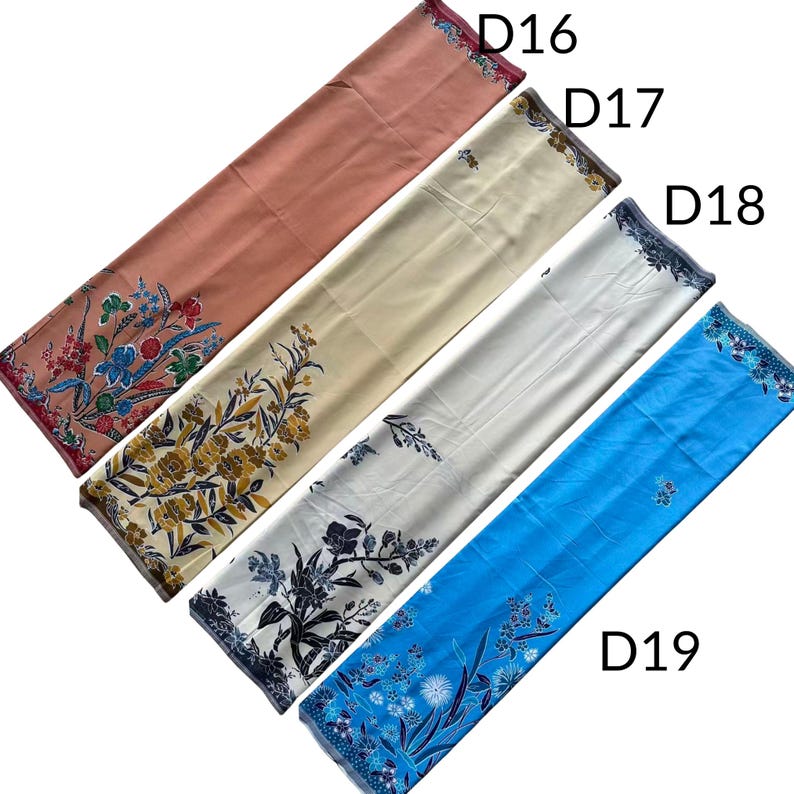 May include: Four rectangular fabric pieces labeled D16, D17, D18, and D19. D16 is dusty rose with a colorful floral print. D17 is cream with yellow and brown floral patterns. D18 is white with black floral designs. D19 is bright blue with blue floral motifs.