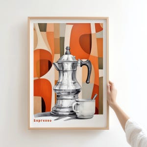 May include: Framed art print featuring a silver espresso maker and a white cup with a spoon. The background has an abstract design in shades of orange, brown, and beige. The word "Espresso" is printed at the bottom.