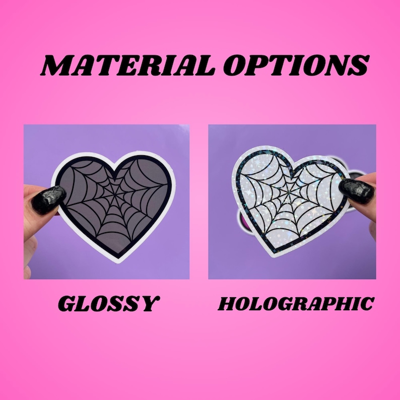 May include: Two heart-shaped stickers with a spiderweb design. The sticker on the left is glossy and the sticker on the right is holographic.