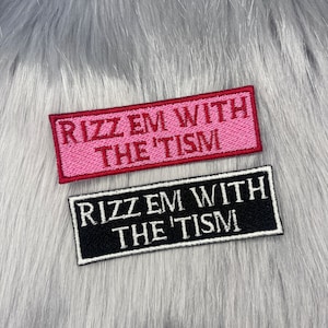 May include: Two iron-on patches with the text "Rizz Em With The 'Tism" in white and red lettering on a black and pink background.