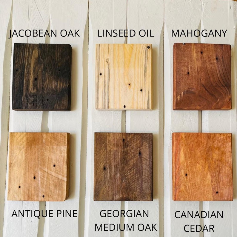 May include: Six wood stain samples, labeled from top to bottom: Jacobean Oak, Linseed Oil, Mahogany, Antique Pine, Georgian Medium Oak, Canadian Cedar.