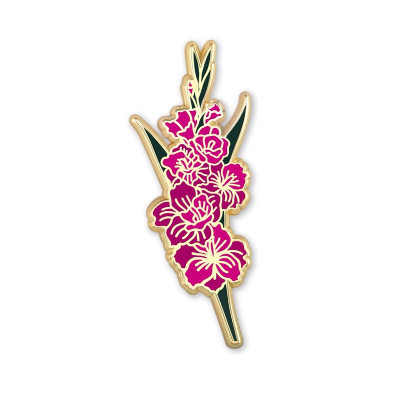 May include: Gold-tone enamel pin featuring a pink gladiolus flower with green leaves.