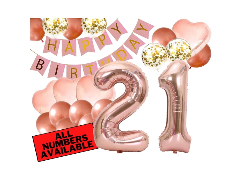May include: Rose gold 21st birthday party decorations with balloons, a banner that says "Happy Birthday", and a sign that says "All Numbers Available".
