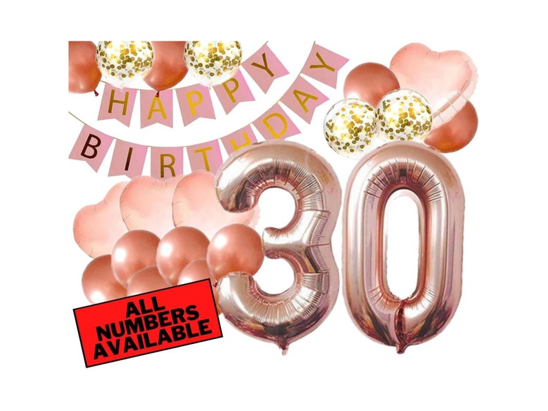 May include: Rose gold 30th birthday party decorations with balloons, a banner that says "Happy Birthday", and a sign that says "All Numbers Available".