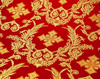 May include: Red fabric with a gold pattern of crosses, wheat stalks, and floral designs.