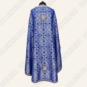 May include: A blue liturgical vestment with a silver and gold cross design. The vestment has a silver trim and a silver cross on the back.