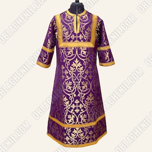 May include: A purple liturgical vestment with gold embroidery featuring a floral pattern and crosses. The vestment has a high collar and a V-neckline.