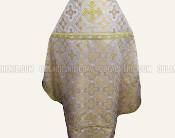 May include: White and gold liturgical vestment with a cross design. The vestment has a gold trim and a cross embroidered on the front.