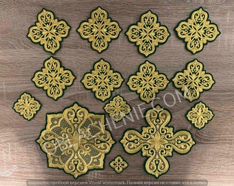 May include: A set of 14 gold embroidered patches with intricate designs. The patches are on a brown wooden surface. The patches are all different sizes and shapes, but they all have a similar design. The patches are perfect for adding a touch of elegance to any project.