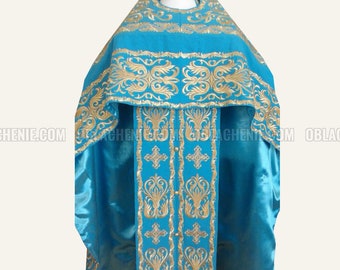 May include: A blue liturgical vestment with gold embroidery. The vestment has a long, flowing cape and a decorative band around the neck. The embroidery features intricate floral patterns.