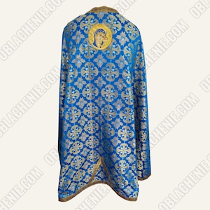 May include: A blue liturgical vestment with a gold pattern and a small icon of the Virgin Mary on the back.