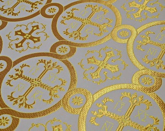 May include: White fabric with a repeating pattern of gold circles and crosses. The crosses are surrounded by a floral design and the text "NI KA" is written on each cross.