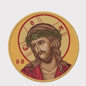 May include: Embroidered patch depicting Jesus Christ wearing a crown of thorns, set against a gold background with a cross and Greek lettering. The lettering reads "IC XC".